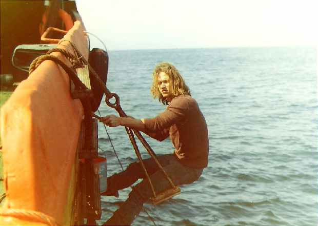 Crewman Dean paints ship side
