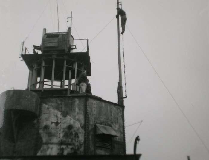 Dick Palmer up mast with Keith Robinson