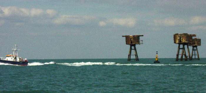Pilot vessel passes Shivering Sands Forts