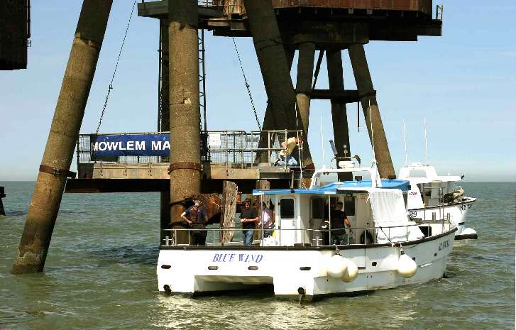 Taking kit aboard Red Sands Fort