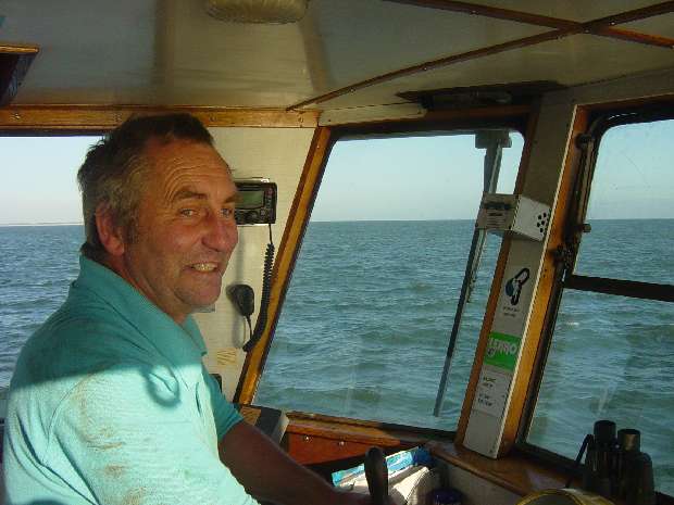 Skipper Alan Littlewort at X-Pilot helm